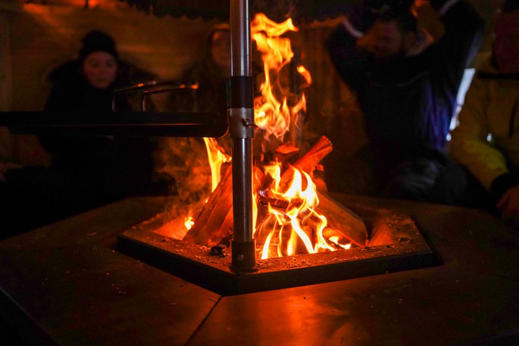 Open fire in wooden hut at Reindeer Farm Porohaka, Rovaniemi