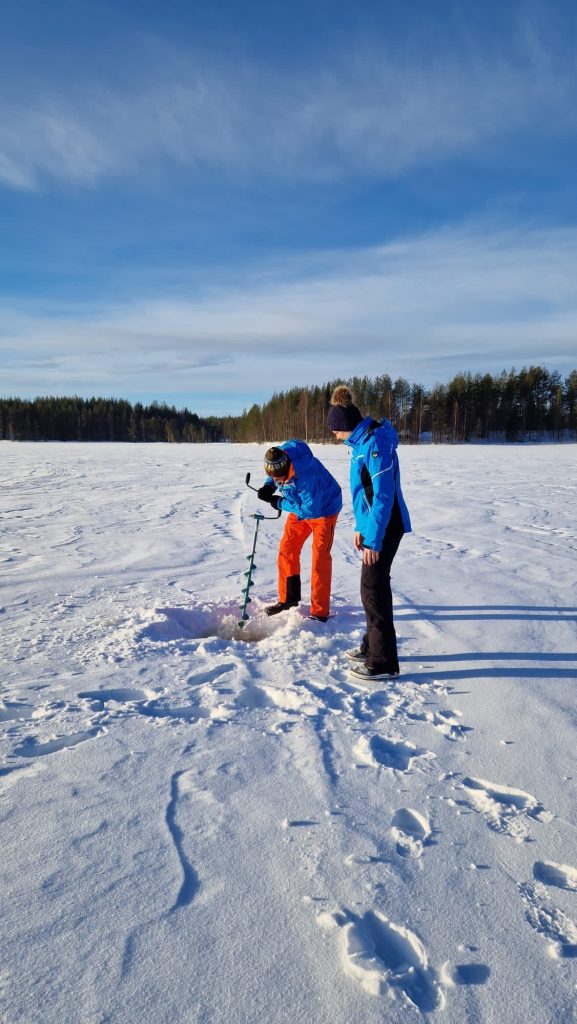 Our guest fishing on the ice in Villa Vasa, Rovaniemi